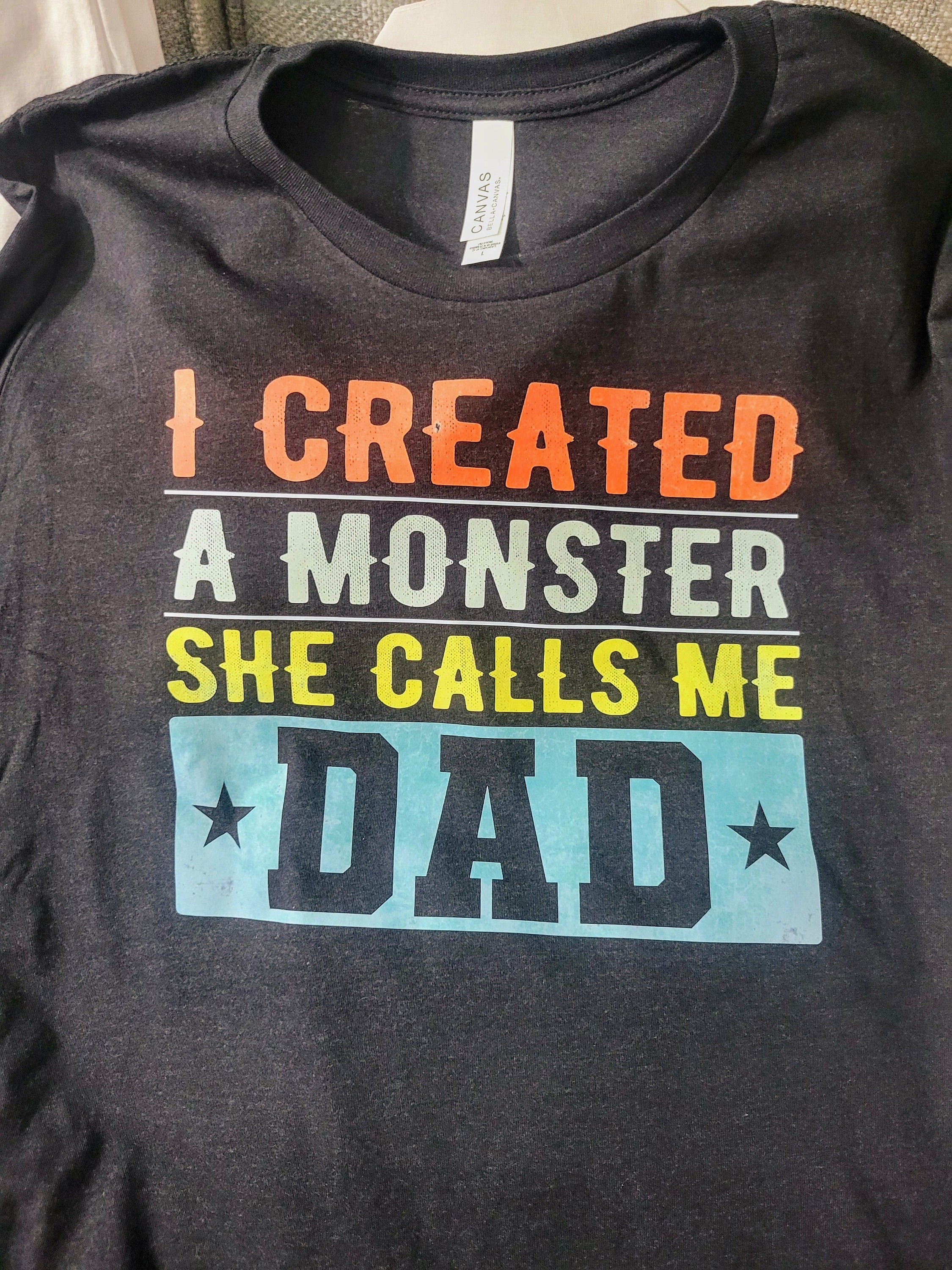 I Created a Monster and She Calls Me Dad-Long, Short Sleeve T, Tote Bag, Crew, Hoodie, Unisex/Youth